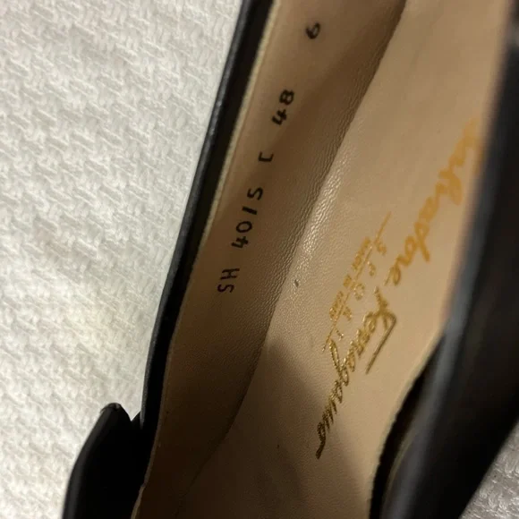 Salvatore Ferragamo Black Loafer Flats with silver logo hardware. Corpcore